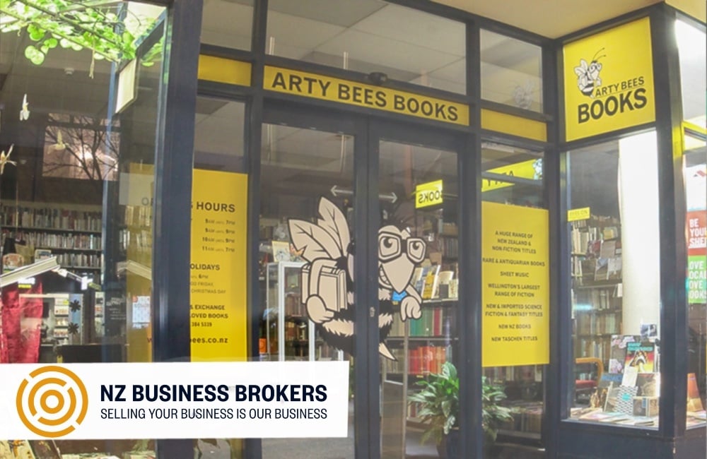 Arty Bees Books shopfront on Cuba Street Wellington, iconic yellow signage and bee mascot