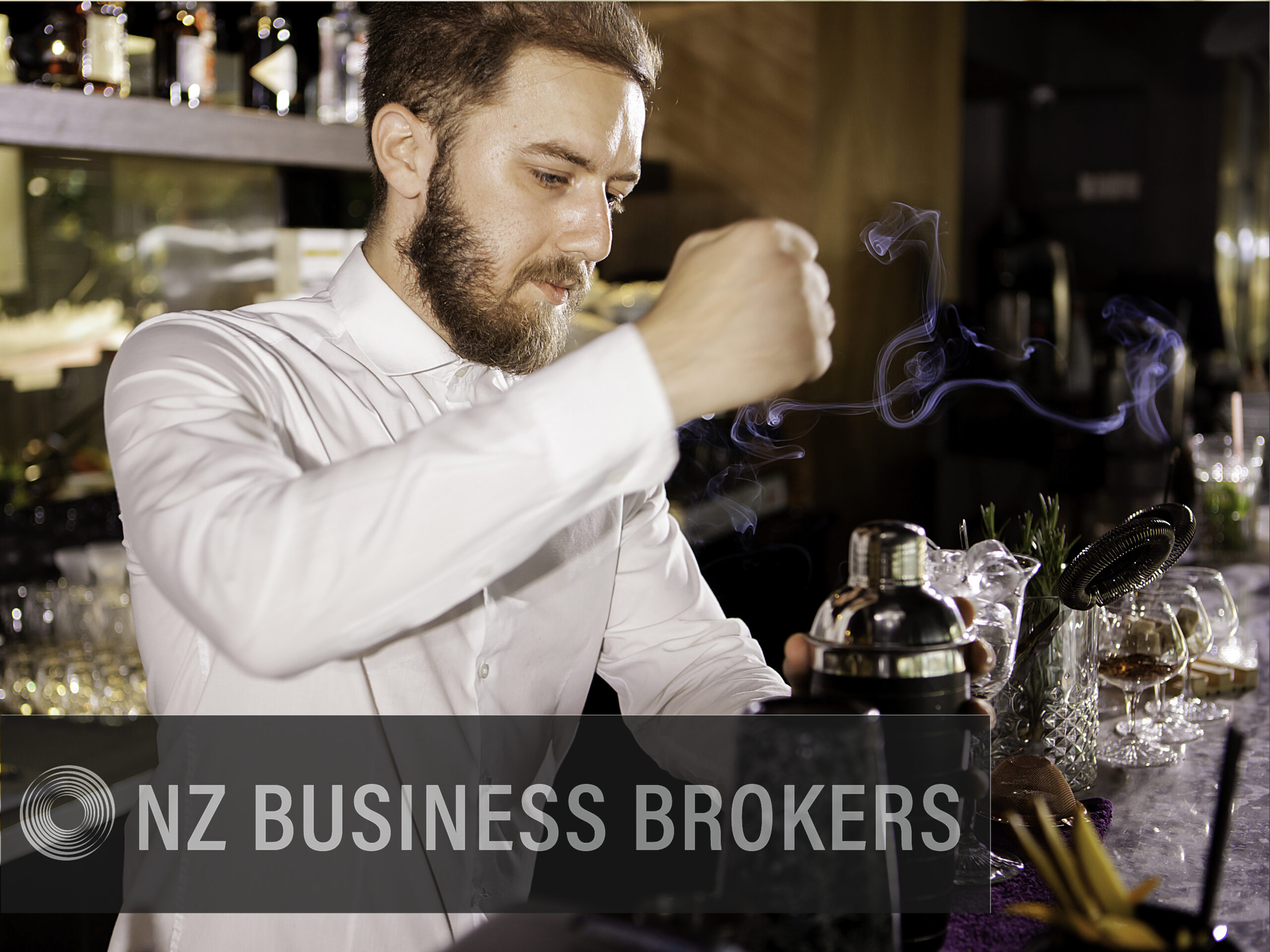 Bartender preparing a smoked cocktail at a gastro bar