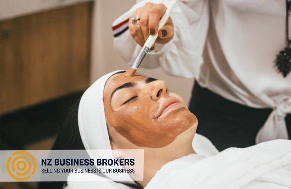 Beauty therapist applying a facial treatment at a Pukekohe beauty clinic
