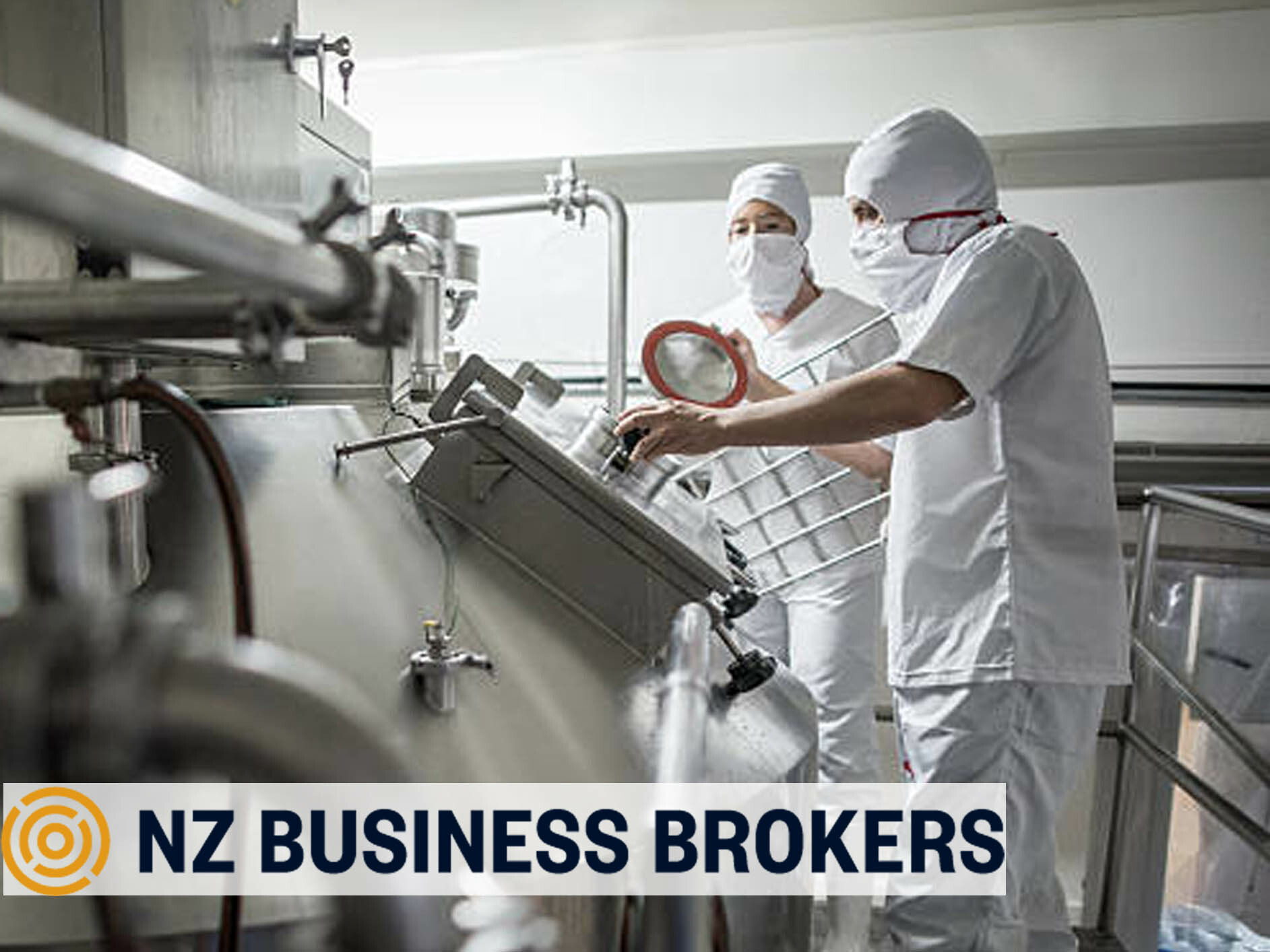 Workers in protective gear operating equipment in a NZ food manufacturing facility