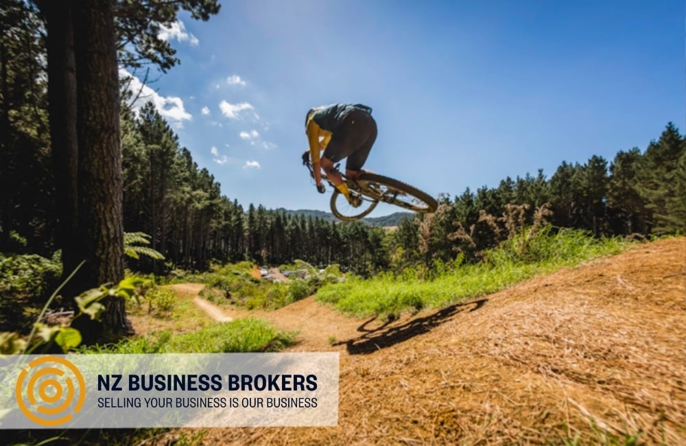 Mountain biker jumping on a purpose-built cycle track in New Zealand