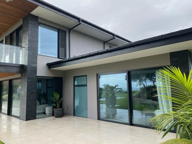 Modern home exterior showing specialist plastering and painting work, Bay of Islands