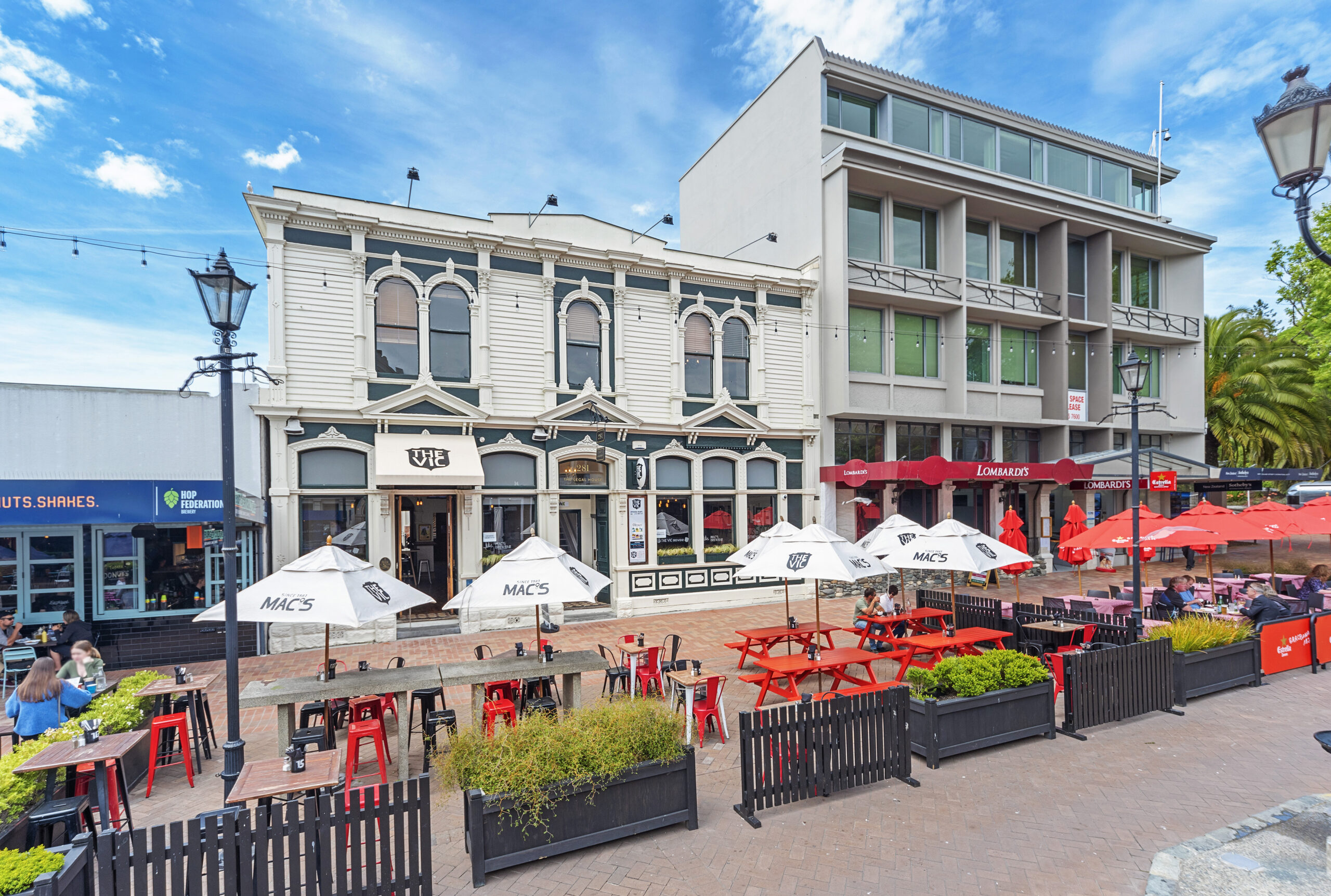The Vic gastro pub on Trafalgar Street Nelson, with outdoor seating and Mac's beer umbrellas